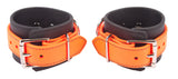 Rubber Wrist Cuffs Orange and Black BioThane Restraints